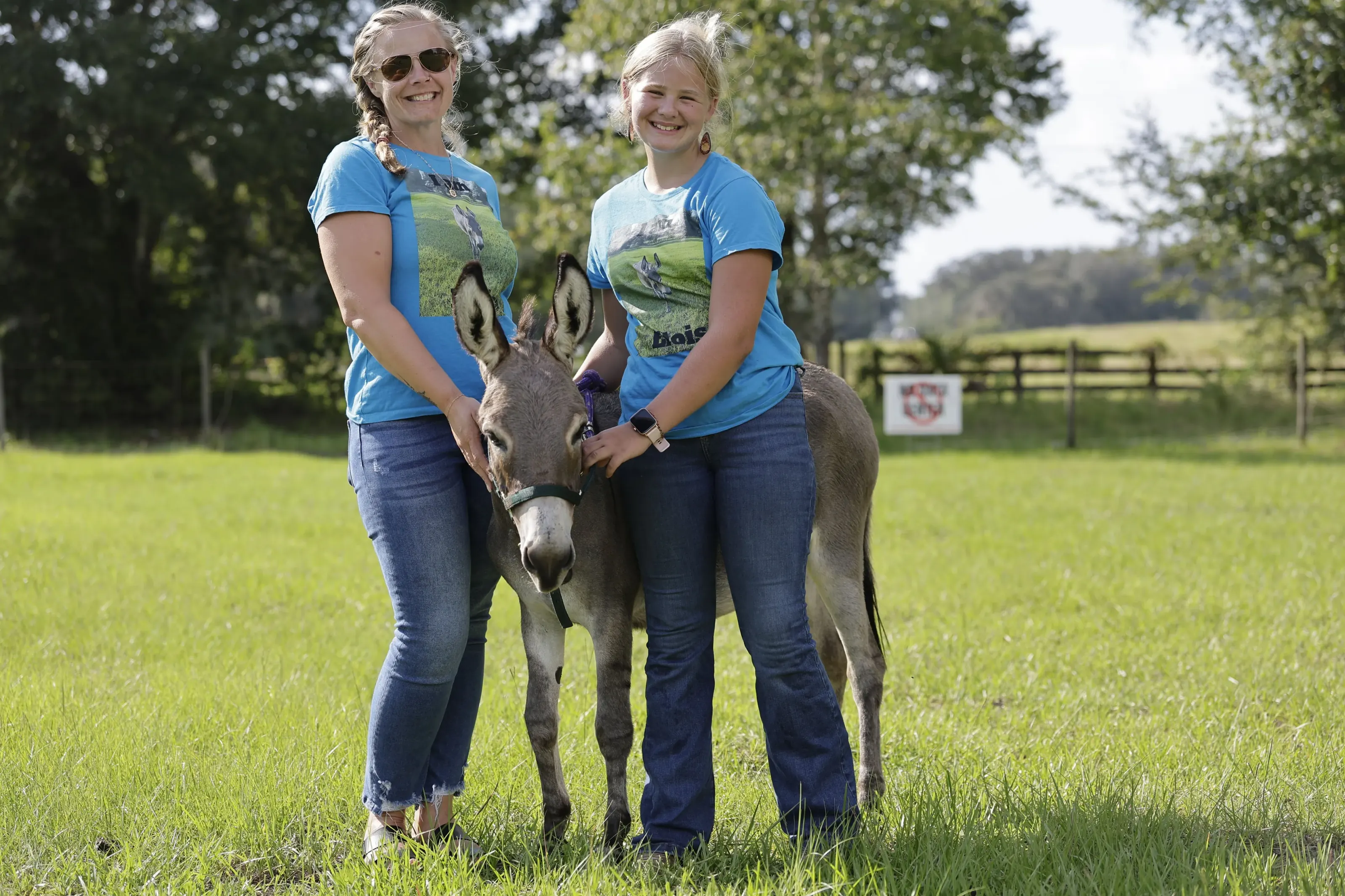 Eloise standing in a pasture with members of the Osteen family.